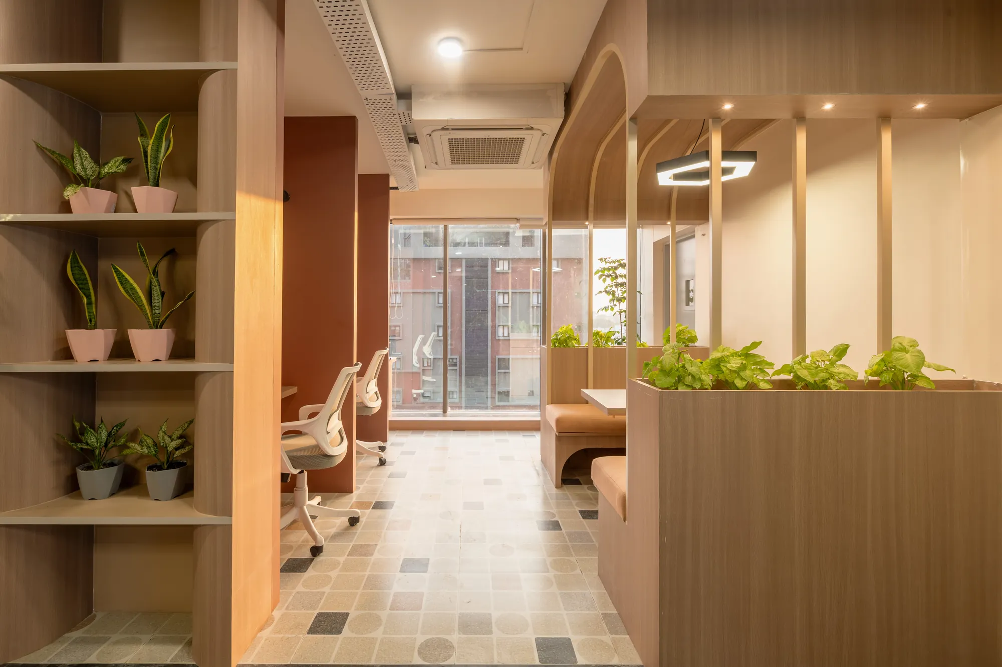 Corridor of timber booths with planters and terrazzo flooring