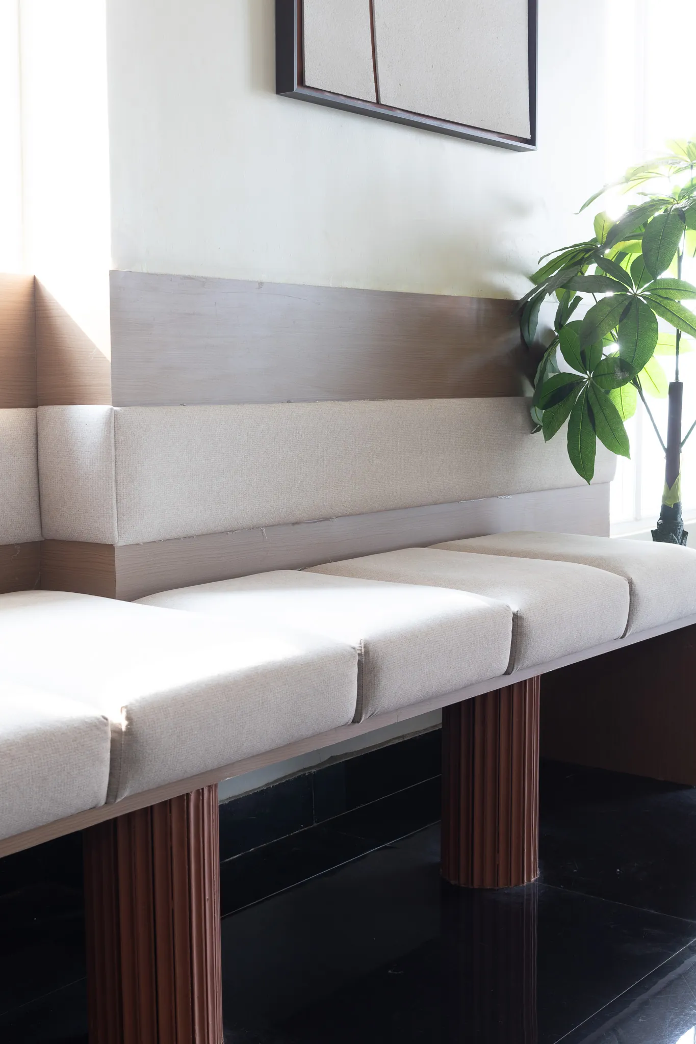 Upholstered bench seating on a fluted timber base