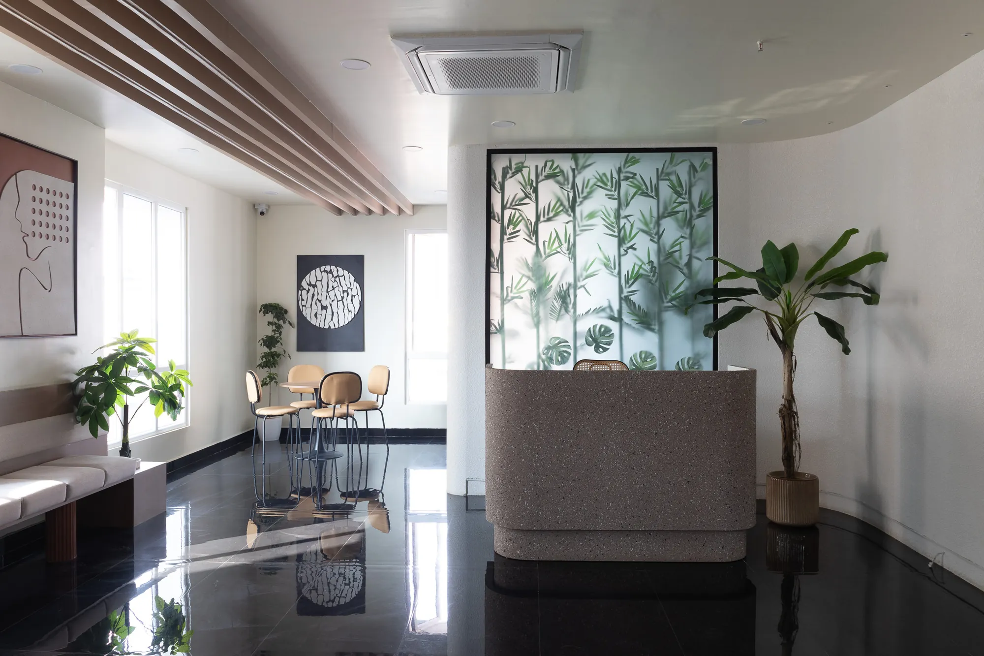 Entrance lounge with a framed botanical screen and timber-slatted ceiling