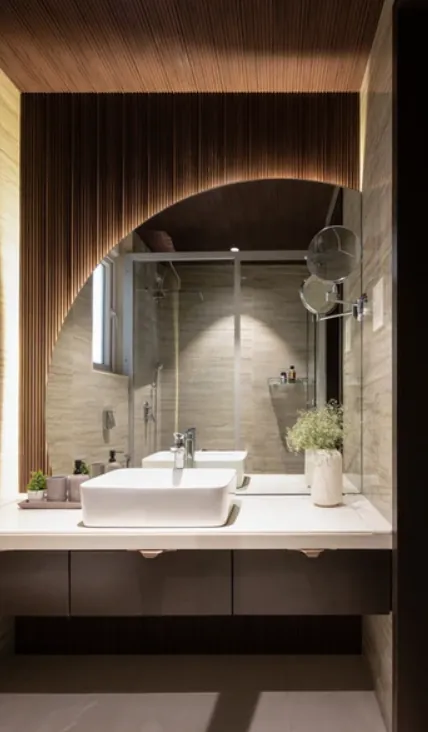 Bathroom with a dark timber arch, vessel basin and glass shower